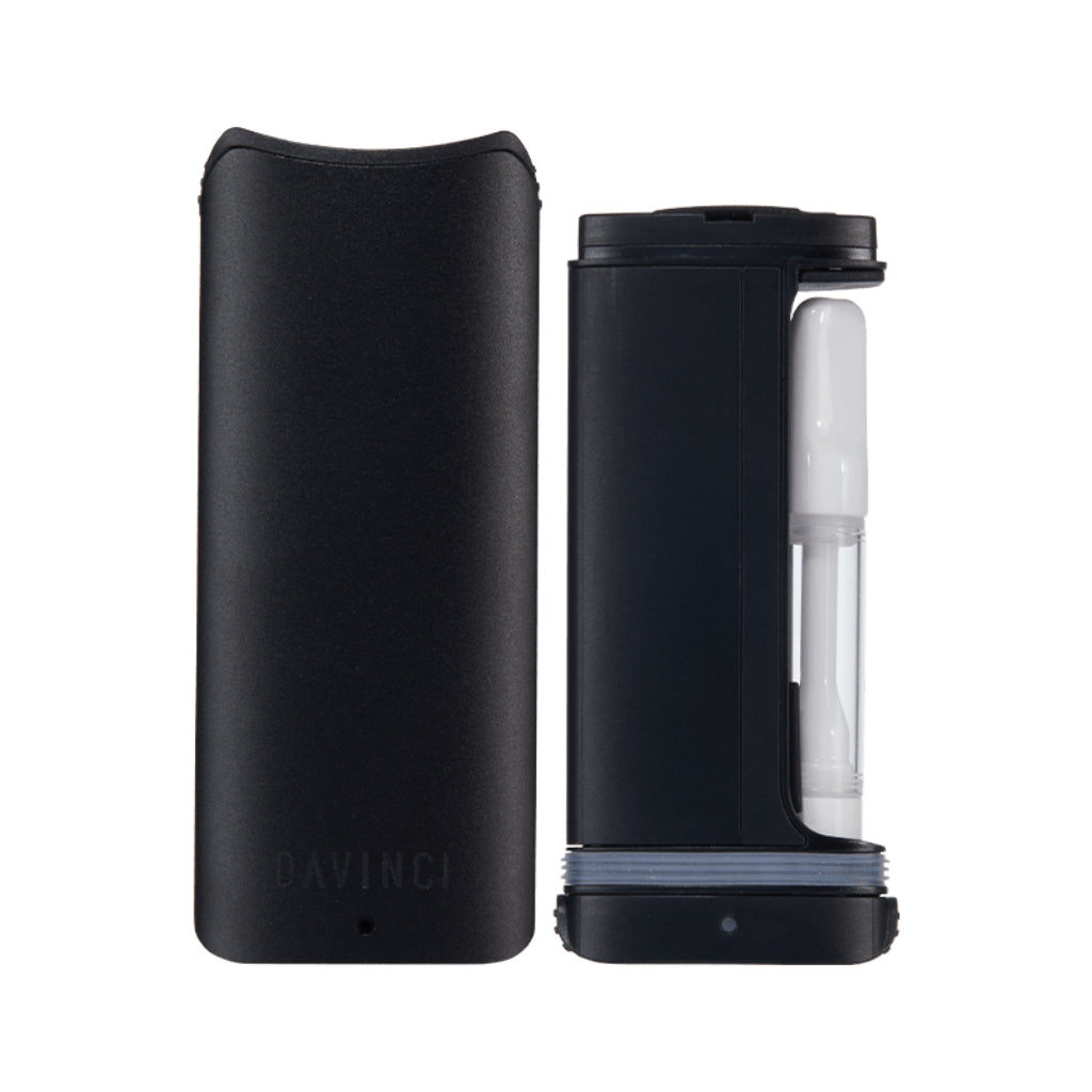 DaVinci ARTIQ Cartridge Vaporizer in sleek black, features a compact design with visible glass cartridge and refined edges.
